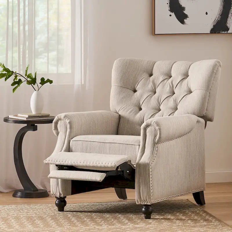 Relaxfauteuil met achteroverduwmechanisme, voetensteun, knopenrug en spijkerkopafwerking