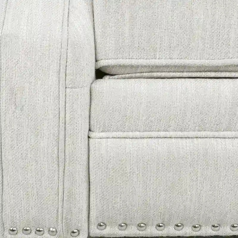 Relaxfauteuil met achteroverduwmechanisme, voetensteun, knopenrug en spijkerkopafwerking